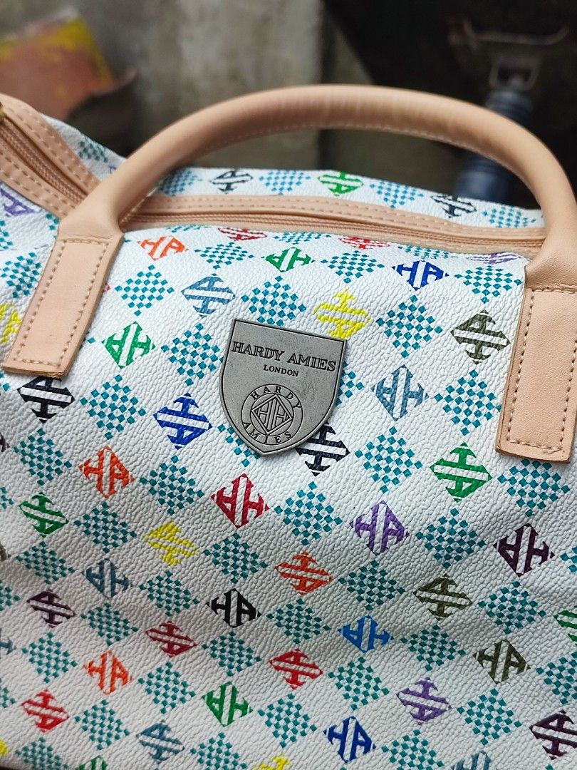 Hardy Amies London Monogram Duffle Bag (Category: Luxury Bags & Wallets) located in Cebu City. Submitted by chimao_dzei (Listing ID 1454197291, Image 2). Description: This is a Hardy Amies London handbag featuring a colorful multi-patterned design and a silver branded shield plaque. 📌The bag is described as lightweight, soft, and suitable for travel or daily use. 📌In perfect condition 📌Very nice in personal✨ 📌Free delivery within Cebu City 📍