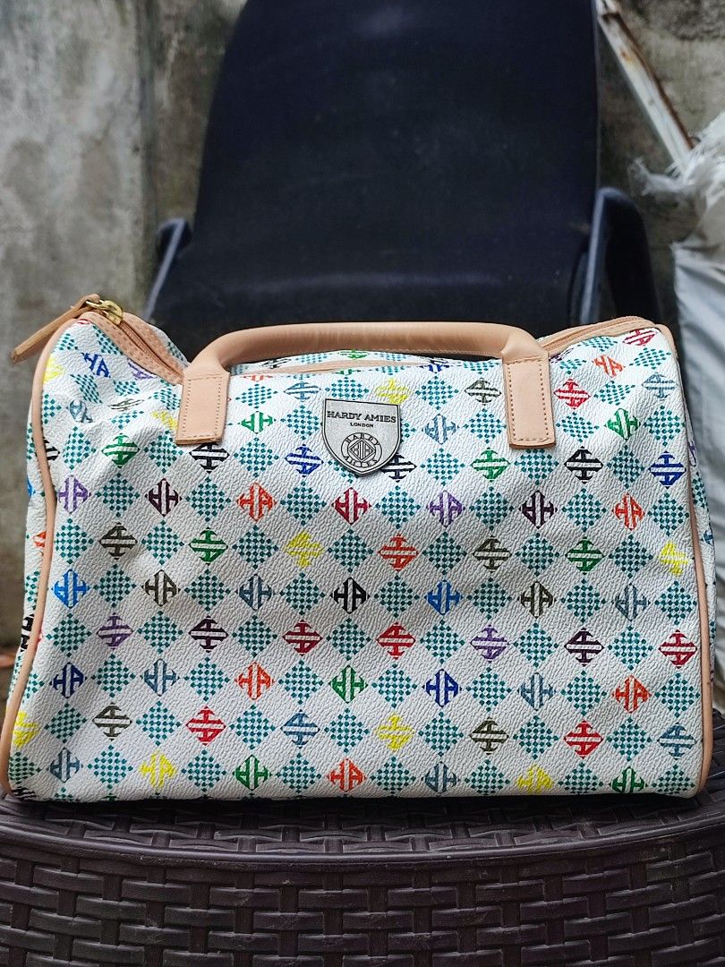 Hardy Amies London Monogram Duffle Bag (Category: Luxury Bags & Wallets) located in Cebu City. Submitted by chimao_dzei (Listing ID 1454197291, Image 1). Description: This is a Hardy Amies London handbag featuring a colorful multi-patterned design and a silver branded shield plaque. 📌The bag is described as lightweight, soft, and suitable for travel or daily use. 📌In perfect condition 📌Very nice in personal✨ 📌Free delivery within Cebu City 📍