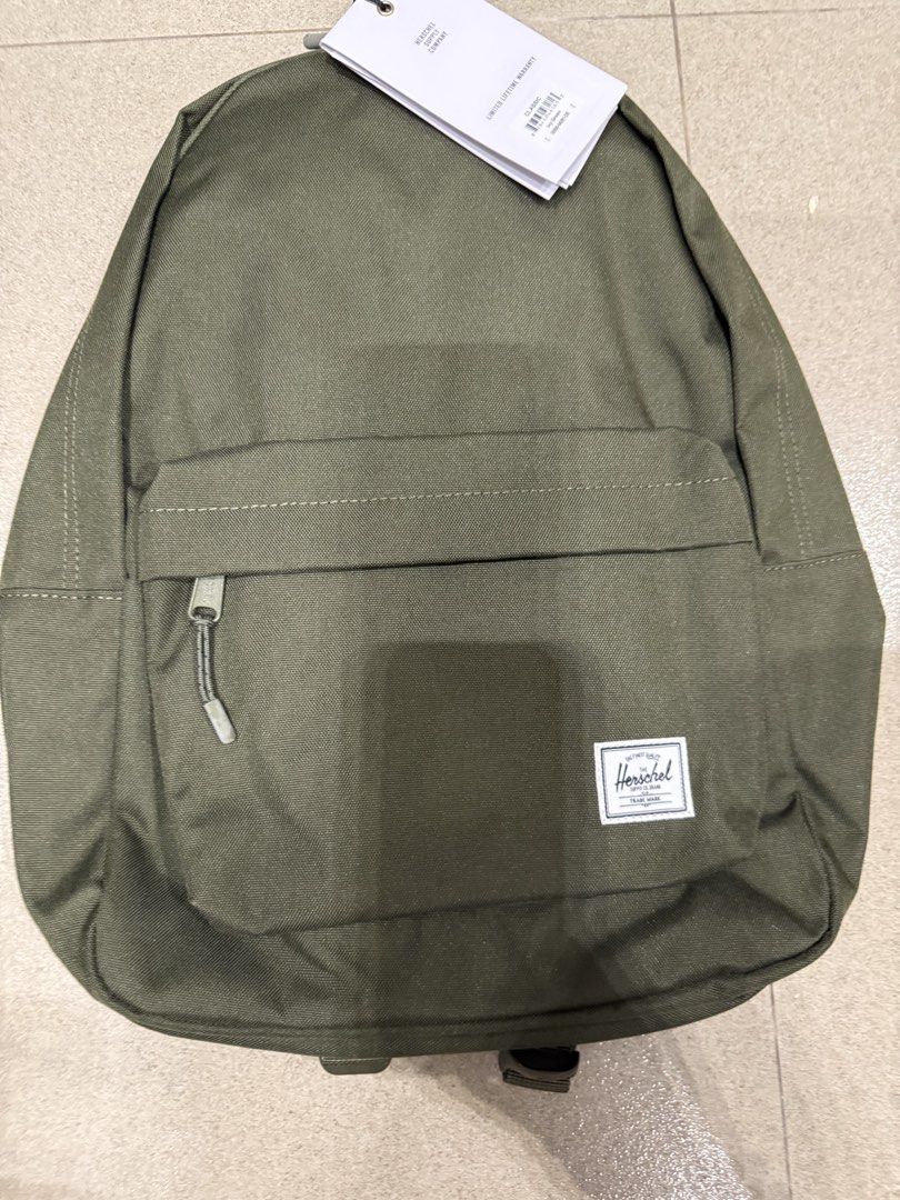 Herschel Little America Backpack - Olive Green (Category: Backpacks) located in Las Pinas. Submitted by happydragon_07d654 (Listing ID 1454350201, Image 2). Description: - Classic Herschel backpack - Color: Olive Green - Features a convenient front zip pocket - Padded shoulder straps for comfort - Ideal for school, work, or everyday use - Brand new with tags still attached.
