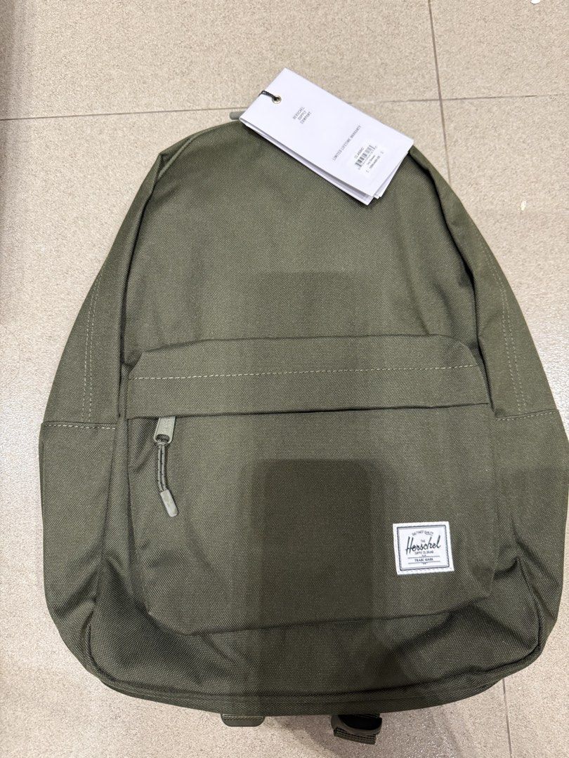 Herschel Little America Backpack - Olive Green (Category: Backpacks) located in Las Pinas. Submitted by happydragon_07d654 (Listing ID 1454350201, Image 1). Description: - Classic Herschel backpack - Color: Olive Green - Features a convenient front zip pocket - Padded shoulder straps for comfort - Ideal for school, work, or everyday use - Brand new with tags still attached.