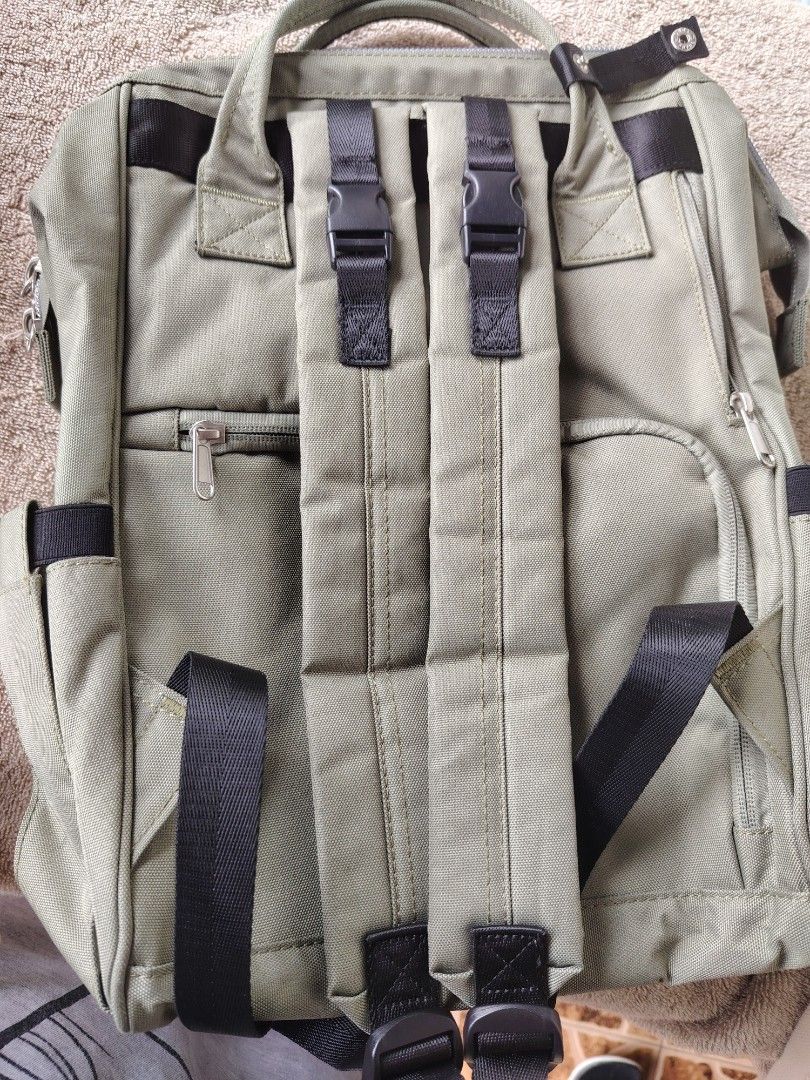 Himawari Diaper Backpack - Khaki Green (Category: Backpacks) located in General Trias. Submitted by ryltecson (Listing ID 1454304010, Image 2). Description: - Khaki green Himawari Diaper backpack - Size 17*14*4 inches - Black front pocket with zipper - Multiple compartments inside for organization - Adjustable straps - Ideal for everyday use or travel with toddler - used twice only - with Free large sling bag .