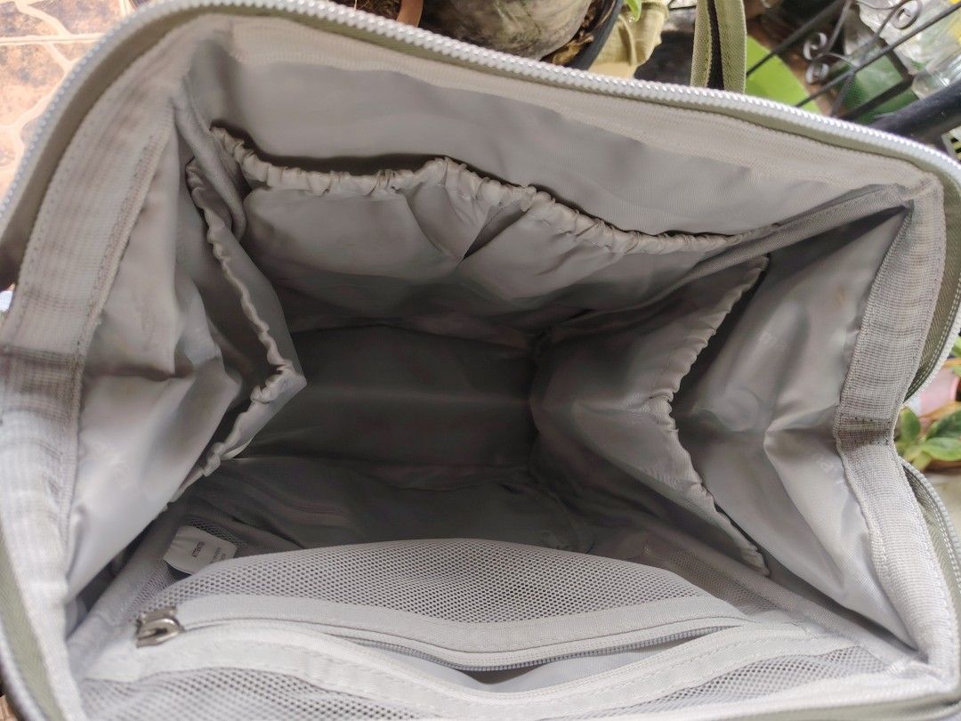 Himawari Diaper Backpack - Khaki Green (Category: Backpacks) located in General Trias. Submitted by ryltecson (Listing ID 1454304010, Image 3). Description: - Khaki green Himawari Diaper backpack - Size 17*14*4 inches - Black front pocket with zipper - Multiple compartments inside for organization - Adjustable straps - Ideal for everyday use or travel with toddler - used twice only - with Free large sling bag .