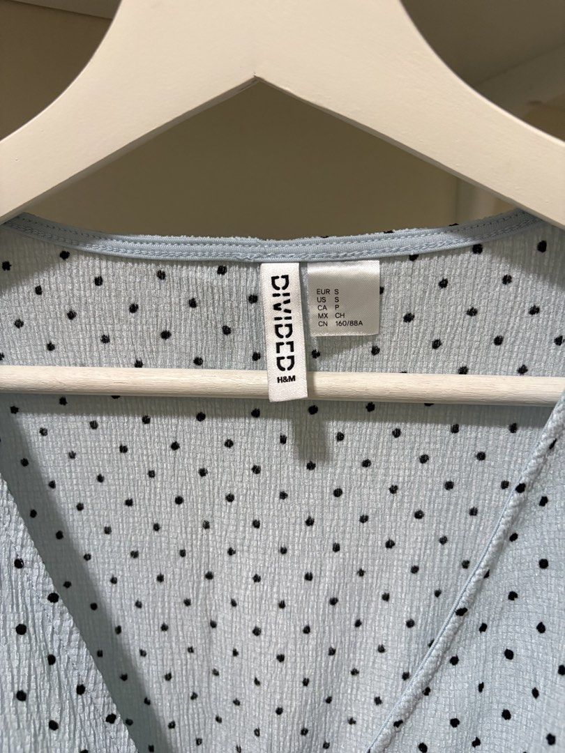H&M Divided Light Blue Polka Dot Peplum Top Size S (Category: Sleeveless) located in Manila. Submitted by cdc98 (Listing ID 1454351985, Image 3). Description: - Light blue peplum top from H&M Divided - Black polka dot pattern - Short puff sleeves - V-neck wrap-style front - Ruffled hem - Elasticated waist - Ideal for pairing with high-waisted jeans or skirts PLEASE READ ⚠️ • Strictly payment first before ship out • Modes of payment - Gcash, BDO, 