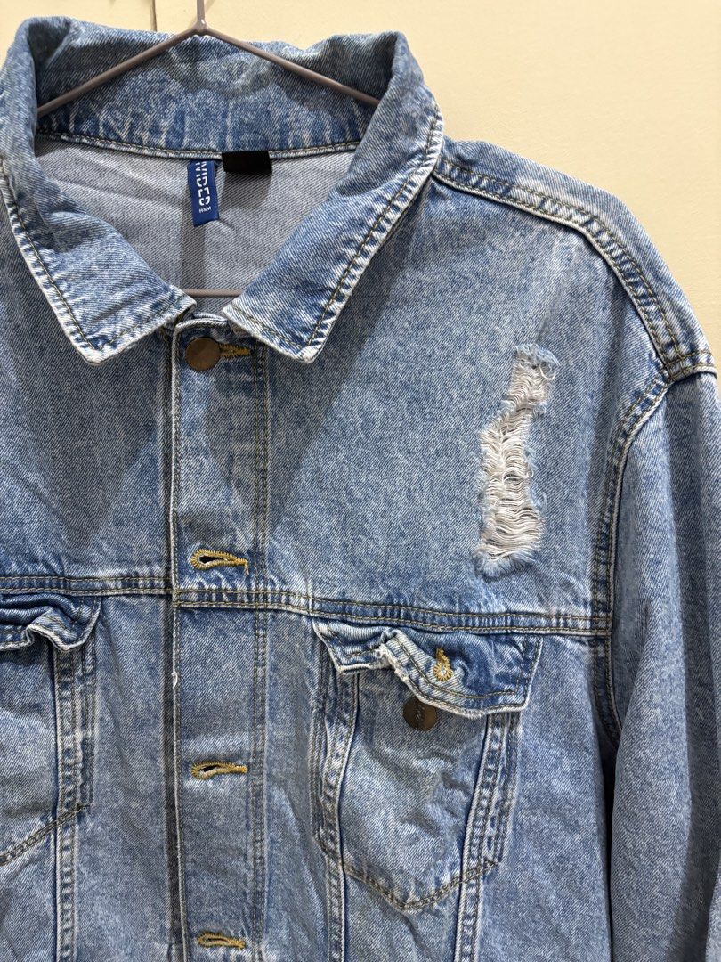 H&M Divided Unisex Light-Washed Distressed Denim Jacket (Category: Coats, Jackets and Outerwear) located in Manila. Submitted by abuyforyou (Listing ID 1454283652, Image 2). Description: Worn a few times 10/10 condition L - 26 1.25" W - 23 1.25".