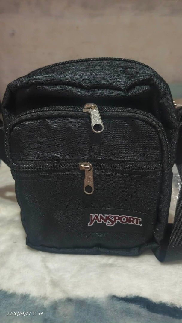 Jansport Black Crossbody Bag (Category: Cross-body Bags) located in Manila. Submitted by clevershark_66b03b (Listing ID 1454279952, Image 1). Description: - Black Jansport crossbody bag - Two zippered compartments for secure storage - Adjustable strap for comfortable wear - Ideal for everyday use - Fits essentials like phone, wallet, and keys - Simple and functional design.