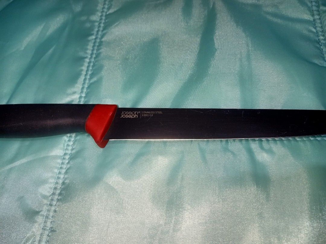 Joseph Joseph Stainless Steel Utility Knife (Category: Knives & Chopping Boards) located in Pasig City. Submitted by urdal01 (Listing ID 1454342156, Image 1). Description: - Brand: Joseph Joseph - Type: Utility Knife - Color: Black handle with red accent - Blade: Stainless steel, sharp and ready for use - Length: Approximately 8 inches - Ideal for: Everyday kitchen tasks - Handle: Comfortable grip.