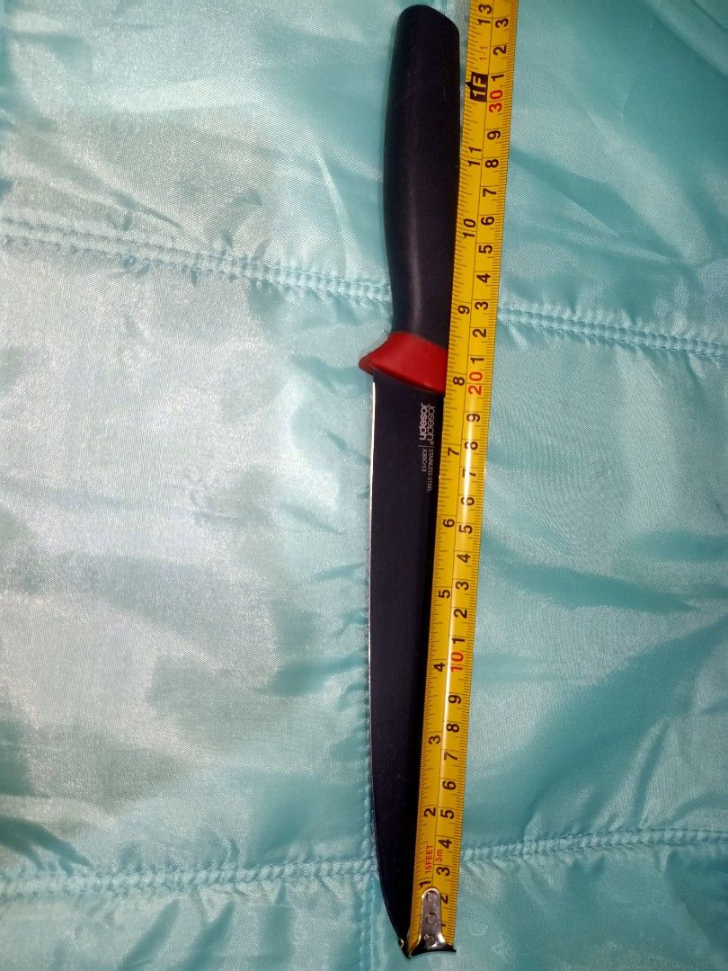 Joseph Joseph Stainless Steel Utility Knife (Category: Knives & Chopping Boards) located in Pasig City. Submitted by urdal01 (Listing ID 1454342156, Image 3). Description: - Brand: Joseph Joseph - Type: Utility Knife - Color: Black handle with red accent - Blade: Stainless steel, sharp and ready for use - Length: Approximately 8 inches - Ideal for: Everyday kitchen tasks - Handle: Comfortable grip.