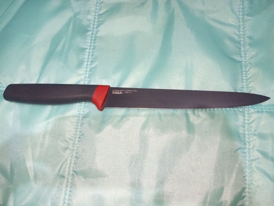 Joseph Joseph Stainless Steel Utility Knife (Category: Knives & Chopping Boards) located in Pasig City. Submitted by urdal01 (Listing ID 1454342156, Image 2). Description: - Brand: Joseph Joseph - Type: Utility Knife - Color: Black handle with red accent - Blade: Stainless steel, sharp and ready for use - Length: Approximately 8 inches - Ideal for: Everyday kitchen tasks - Handle: Comfortable grip.