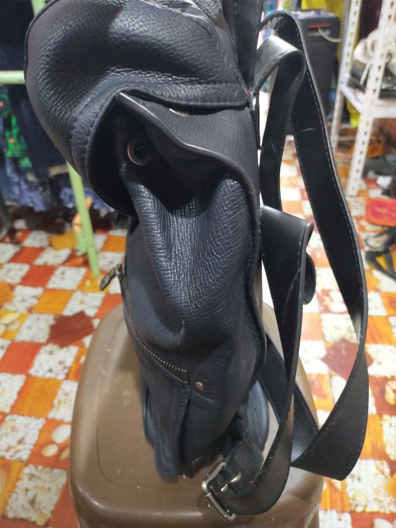 Louis Vuitton Black Leather Backpack (Category: Backpacks) located in Manila. Submitted by buynow328 (Listing ID 1454246756, Image 3). Description: Black leather Louis Vuitton backpack. Has a front zip pocket and a flap closure with buckle and strap. Adjustable shoulder straps. Some signs of wear on the leather and hardware. Check photos for details..