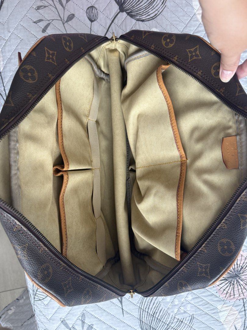 Louis Vuitton Monogram bag (Category: Luxury Bags & Wallets) located in Mandaluyong City. Submitted by pam_1026 (Listing ID 1454351547, Image 2). Description: - Classic Louis Vuitton monogram travel bag - Spacious interior with multiple pockets - Leather trim and handles show some wear - Zipper works smoothly - Perfect for weekend trips or as a carry-on.