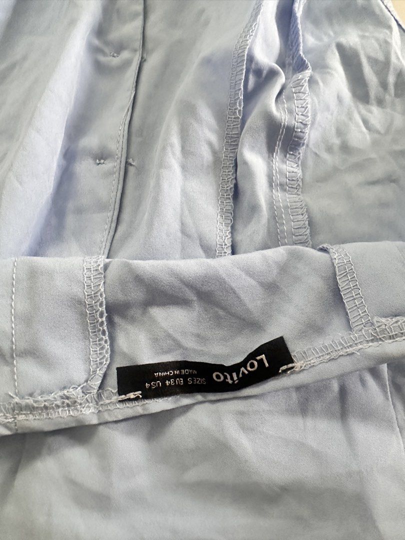 Lovito Light Blue Button-Up Halter Top Backless (Category: Sleeveless) located in Sorsogon. Submitted by declutter.sandie (Listing ID 1454231725, Image 2). Description: - Adorable light blue pet shirt - Classic button-up front design - Features a stylish collar - Made from lightweight, comfortable fabric - Ideal for making your furry friend look dapper.