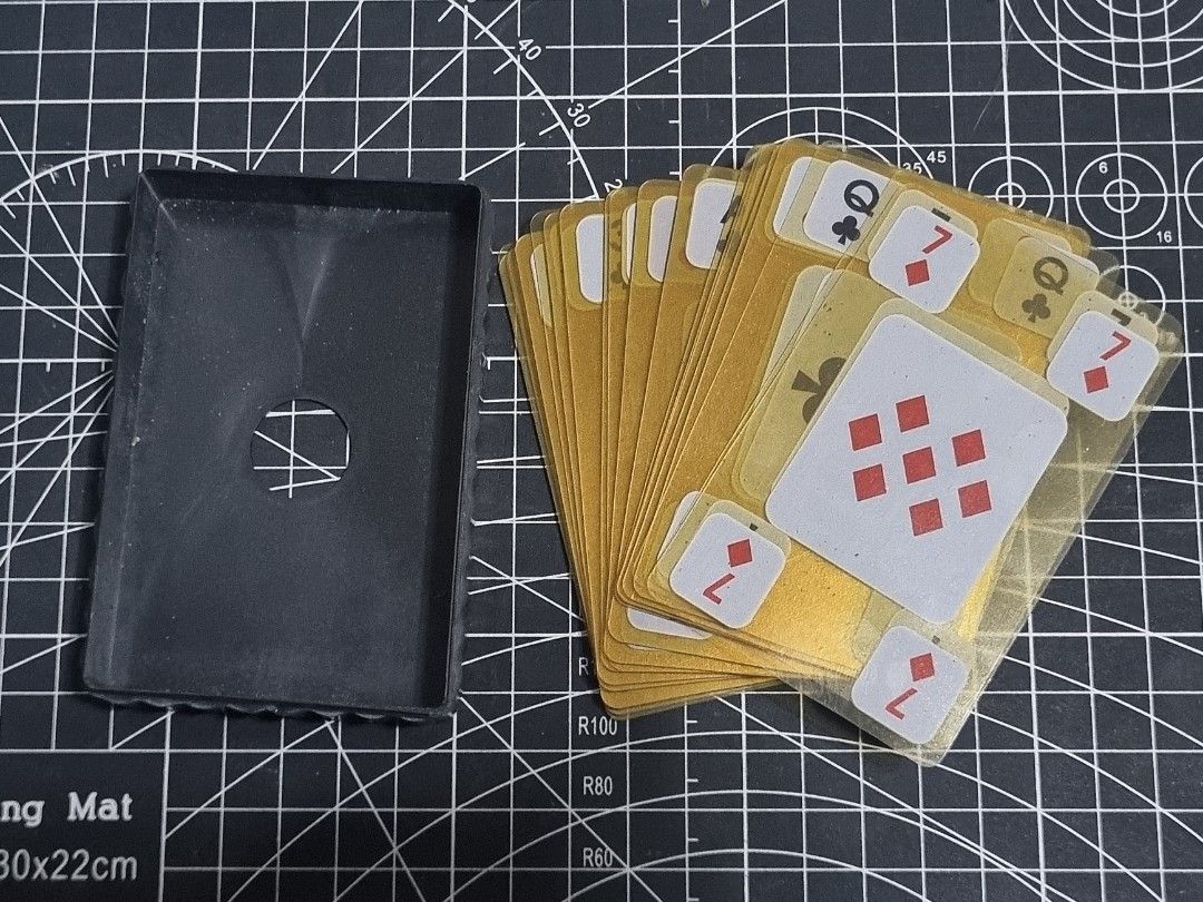 Matryoshka Patchwork Playing Cards (Category: Board Games & Puzzles) located in Manila. Submitted by xeedoxee (Listing ID 1454292787, Image 2). Description: - These are waterproof playing cards featuring a patchwork design of Russian nesting dolls. - The deck consists of 54 cards made from transparent plastic. The design includes red and blue patterned graphics reminiscent of traditional Matryoshka dolls. Case is a bit cracked but cards are in go