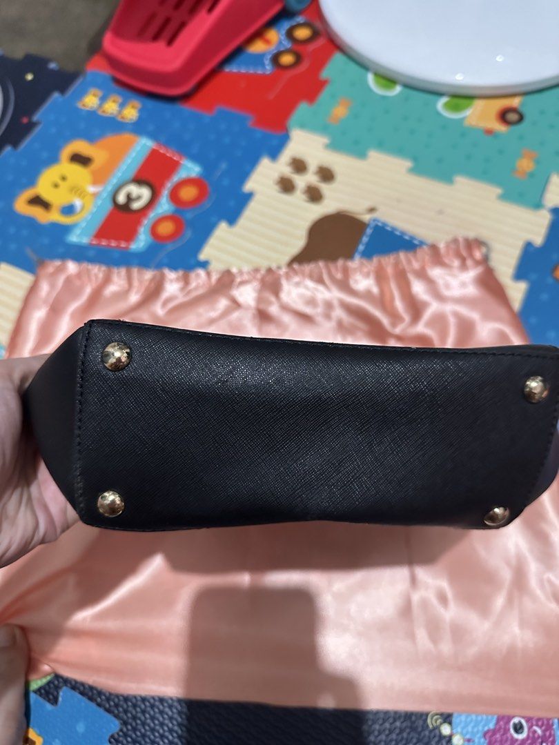 Michael Kors Black Saffiano Leather Bag (Category: Luxury Bags & Wallets) located in Santa Rosa. Submitted by babicdln (Listing ID 1454230720, Image 3). Description: - Authentic Michael Kors Black Saffiano Leather Bag - Slightly used - with Sling .