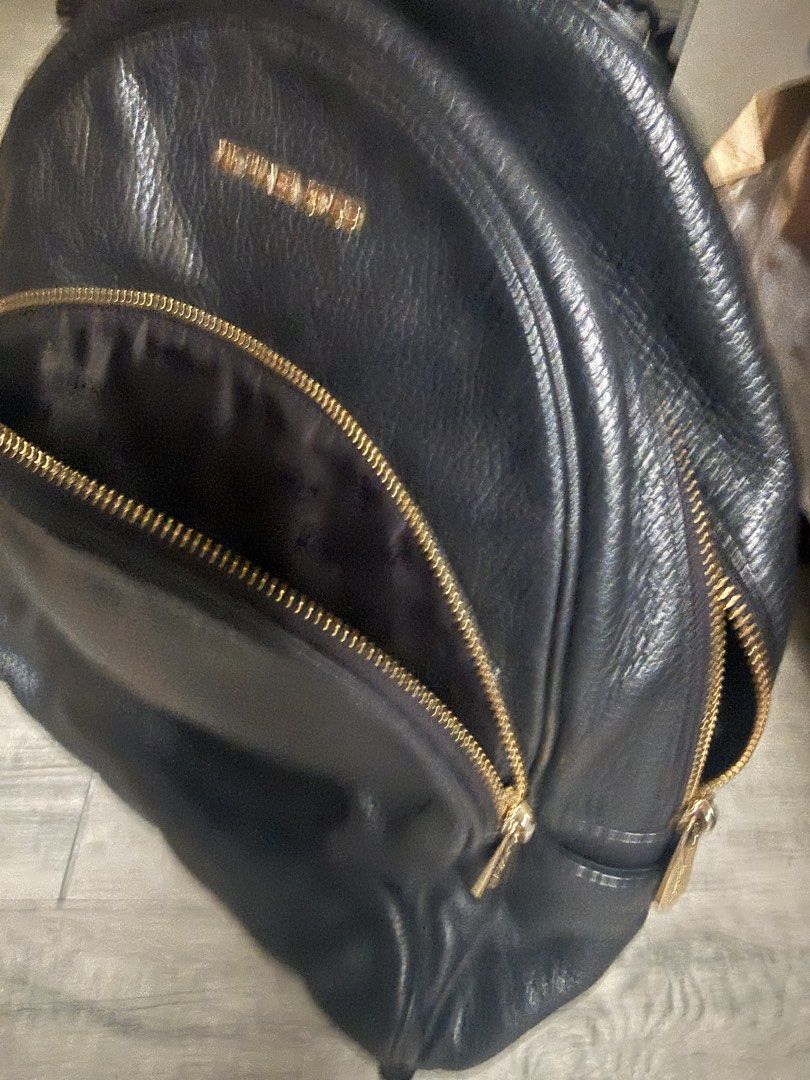 Michael Kors large leather backpack (Category: Backpacks) located in Antipolo. Submitted by 2003preloved (Listing ID 1454201638, Image 2). Description: Authentic Michael Kors black pebbled leather backpack with gold-tone hardware. Spacious and lightweight, perfect for work, travel, or everyday use. In good pre-loved condition with normal signs of use. Clean interior and all zippers are working. .