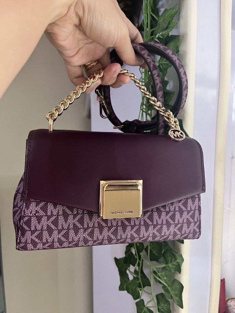 Michael Kors Monogram Chain Shoulder Bag (Category: Luxury Bags & Wallets) located in Makati City. Submitted by shoplin (Listing ID 1454222347, Image 1). Description: Brand New (never been use) Authentic Michael Kors Small Lita bag Location: Makati No flaws. Gcash payment first basis Selling low. J&T/ Lalamove ready - Authentic Michael Kors bag - Signature MK monogram pattern - Rich burgundy leather accents - Elegant gold chain strap and hardware