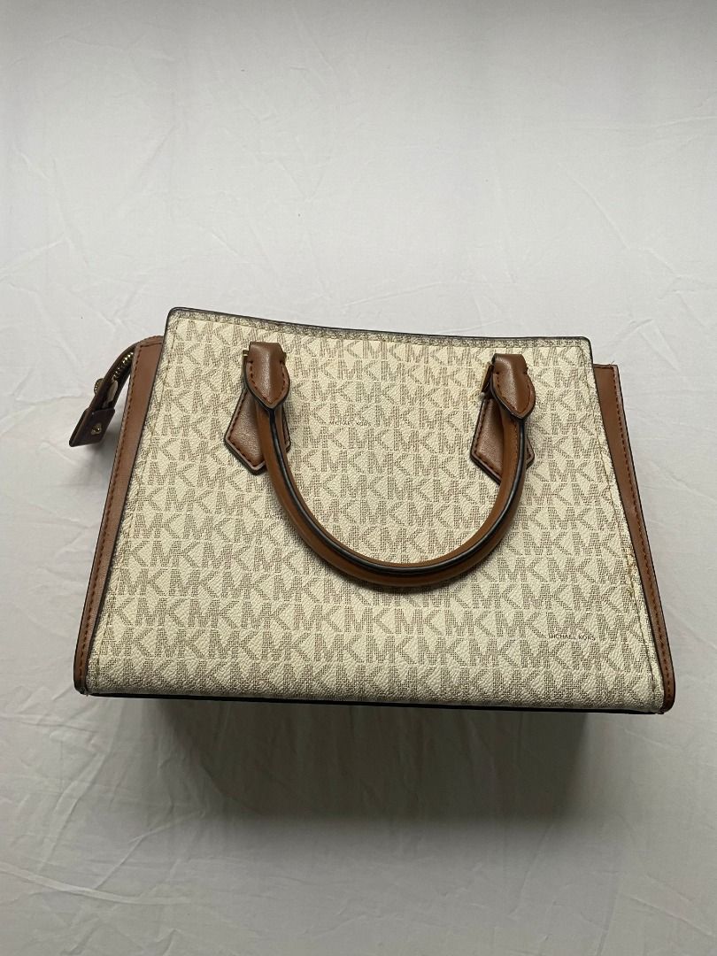 Authentic Michael Kors Chantal Small Logo Messenger Bag (Category: Luxury Bags & Wallets) located in Caloocan City. Submitted by grandtiger_aeaf1d (Listing ID 1454261495, Image 2). Description: A compact, structured messenger bag with MK's signature logo print and gold-tone chain-link strap. Used only about 5 times — canvas is clean, hardware is bright. Perfect for everyday errands, nights out, or as a compact work bag. Comes with a detachable cr