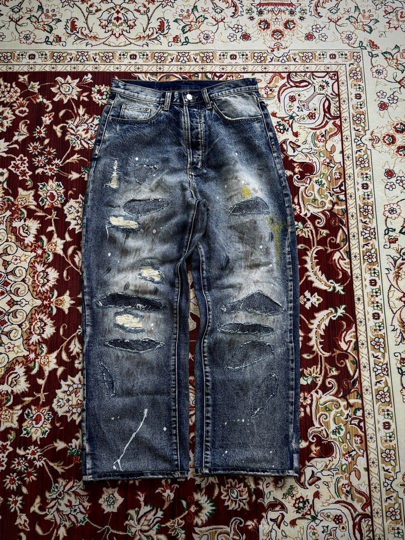 MNML Ultra Baggy Distressed Jeans (Category: Jeans) located in San Juan, La Union. Submitted by bornunderground.ph (Listing ID 1454246812, Image 2). Description: MNML Ultra Baggy Distressed Jeans Authentic/ Like New Sale @ ₱2,495 Plus Shipping - It delivers a heavily customized, vintage streetwear aesthetic. Size: 30 (Model Height 5”7) Silhouette: Cut in an ultra-baggy, wide-leg straight fit that pools casually over sneakers. Heavy Destruction: F