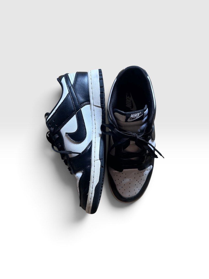 Nike SB Dunk Low Retro White Black Panda (Category: Sneakers & Footwear) located in Quezon City. Submitted by high.score (Listing ID 1434297483, Image 1). Description: The Nike Dunk Low Retro White Black (GS) silhouette comes in a stark black and white colorway and is made from premium leather materials throughout. Additionally, white Nike lettering complements the rear ankle support of the silhouette while the Nike Air text along with the custom