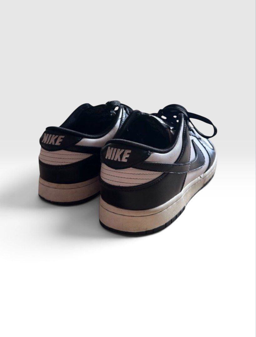 Nike SB Dunk Low Retro White Black Panda (Category: Sneakers & Footwear) located in Quezon City. Submitted by high.score (Listing ID 1434297483, Image 2). Description: The Nike Dunk Low Retro White Black (GS) silhouette comes in a stark black and white colorway and is made from premium leather materials throughout. Additionally, white Nike lettering complements the rear ankle support of the silhouette while the Nike Air text along with the custom