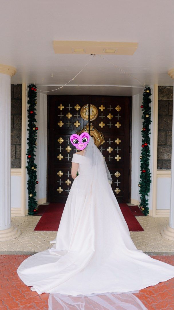 Off-Shoulder Satin Wedding Dress with Veil (Category: Announcements) located in Mandaluyong City. Submitted by mkaba (Listing ID 1454312110, Image 1). Description: - Beautiful off-shoulder wedding gown - Made of luxurious satin fabric - Features a full skirt and elegant train - Comes with a matching veil - Comfortable for dancing and celebrating - Designed to make you feel like a princess.
