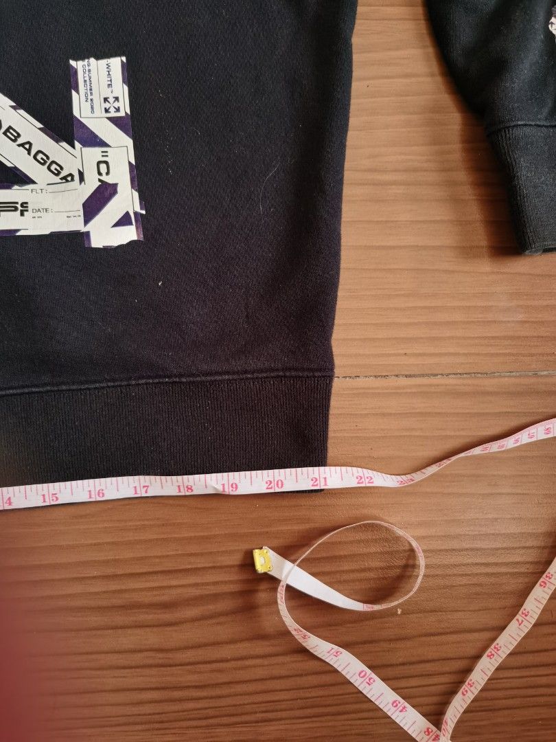OFF-WHITE "MAIN LABEL" Black Hoodie (Category: Hoodies) located in Manila. Submitted by riverairak34457 (Listing ID 1454195908, Image 2). Description: - Authentic Off-White black hoodie - Iconic diagonal arrows graphic on the back - "MAIN LABEL" tag detail - Signature stripes on the sleeves - Functional front pocket - Adjustable drawstring hood - Measurements provided in photos - Essential piece for any streetwear enthusiast Picture given may not