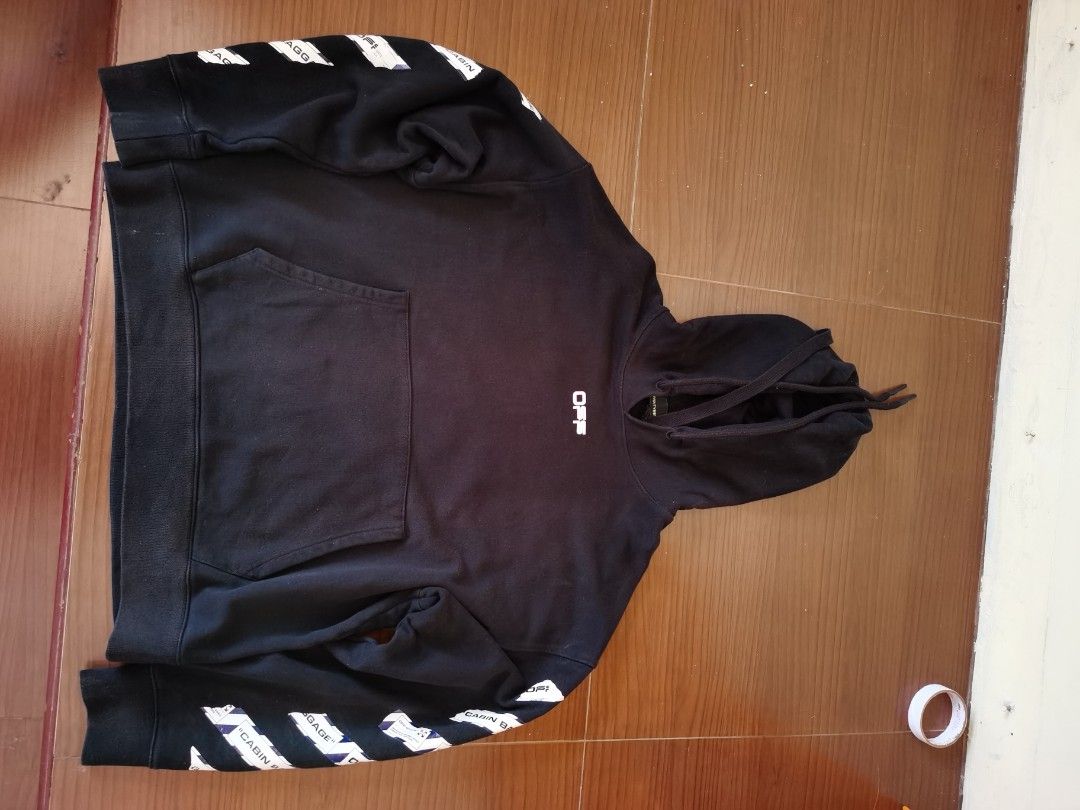 OFF-WHITE "MAIN LABEL" Black Hoodie (Category: Hoodies) located in Manila. Submitted by riverairak34457 (Listing ID 1454195908, Image 3). Description: - Authentic Off-White black hoodie - Iconic diagonal arrows graphic on the back - "MAIN LABEL" tag detail - Signature stripes on the sleeves - Functional front pocket - Adjustable drawstring hood - Measurements provided in photos - Essential piece for any streetwear enthusiast Picture given may not