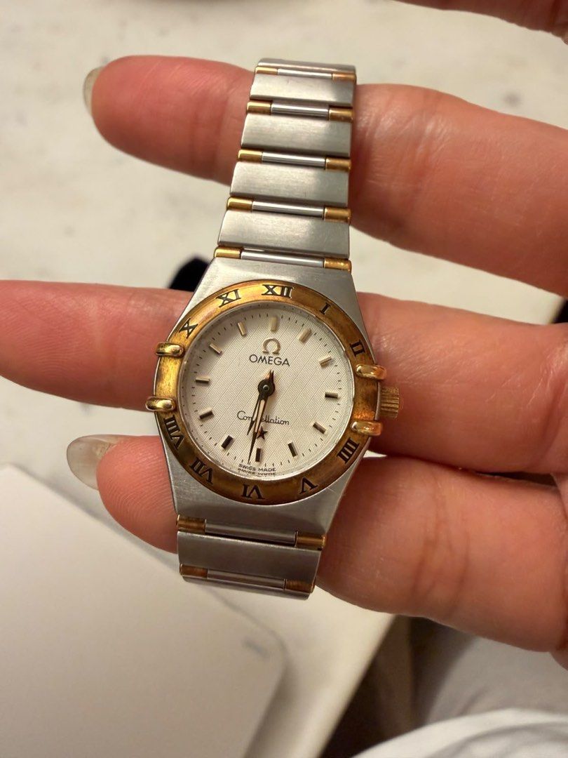 Omega Constellation Two-Tone Ladies Watch (Category: Women's Watches) located in Quezon City. Submitted by qsersera_sales (Listing ID 1454342668, Image 2). Description: - Authentic Omega Constellation watch - Luxurious two-tone stainless steel and gold design - Classic white dial featuring elegant Roman numerals - Versatile style: ideal for daily wear or special events - Ideal for small wrists (with extra links).