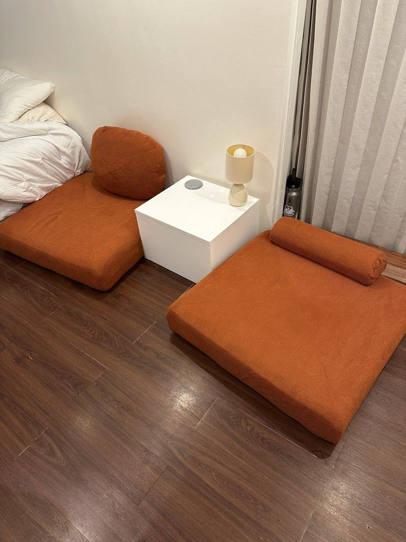 Orange Corduroy Floor Sofa Bed with Pillow (Category: Sofas) located in Paranaque City. Submitted by tinaascloset (Listing ID 1454195816, Image 2). Description: - Cozy orange corduroy floor sofa - Multi-functional: sofa, lounger, or bed - Comes with a matching cushion - Folds flat for easy storage - Ideal for small spaces or creating a reading nook - Adds a vibrant pop of color to your room.