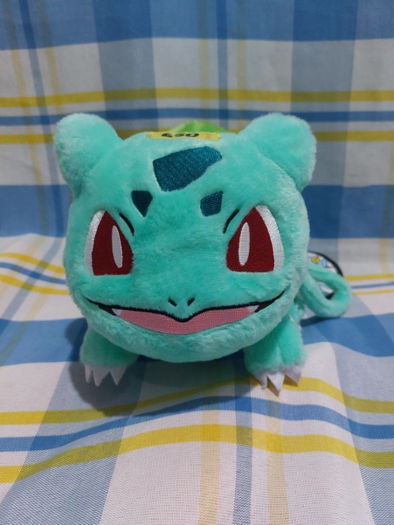 Pokemon Nintendo Bulbasaur Plush Toy Pouch (Category: Plushies & Soft Toys) located in Mandaluyong City. Submitted by 13thsilverrabbit (Listing ID 1454325542, Image 1). Description: Cute Bulbasaur plush toy. Has a zipper compartment on its back. Comes with a keychain loop. Great for Pokemon fans. Perfect to hang on bags or backpacks. Made with soft plush material. Officially licensed Pokemon merchandise..