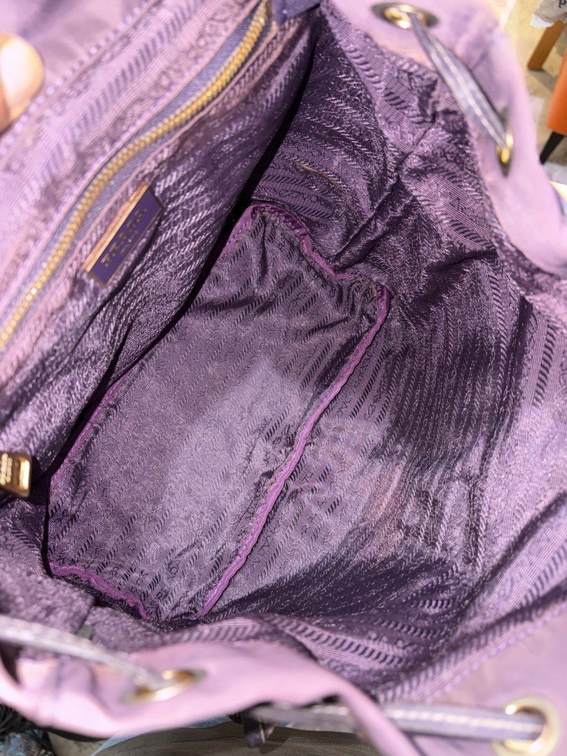 Prada (Category: Backpacks) located in Echague. Submitted by jake_rc (Listing ID 1454204890, Image 3). Description: Prada Nylon material Good condition Has minor fading Yung part na naghohold sa draw string is replace see photo Price 2,000 plus SF.