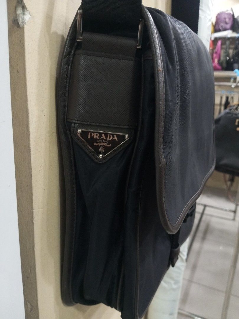 Prada Black Nylon Leather Trim Messenger Bag (Category: Luxury Bags & Wallets) located in Bacolod City. Submitted by exequelgra46775 (Listing ID 1454303426, Image 2). Description: - Authentic Prada messenger bag - Color: Black nylon with brown leather trim - Closure: Zip - Features: Adjustable strap, interior zip pocket - Iconic Prada logo on the front - Made in Italy - Ideal for everyday use - Issue Missing white tag and made in Italy .