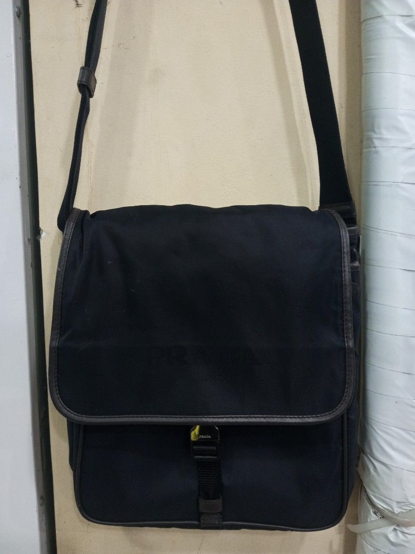 Prada Black Nylon Leather Trim Messenger Bag (Category: Luxury Bags & Wallets) located in Bacolod City. Submitted by exequelgra46775 (Listing ID 1454303426, Image 1). Description: - Authentic Prada messenger bag - Color: Black nylon with brown leather trim - Closure: Zip - Features: Adjustable strap, interior zip pocket - Iconic Prada logo on the front - Made in Italy - Ideal for everyday use - Issue Missing white tag and made in Italy .
