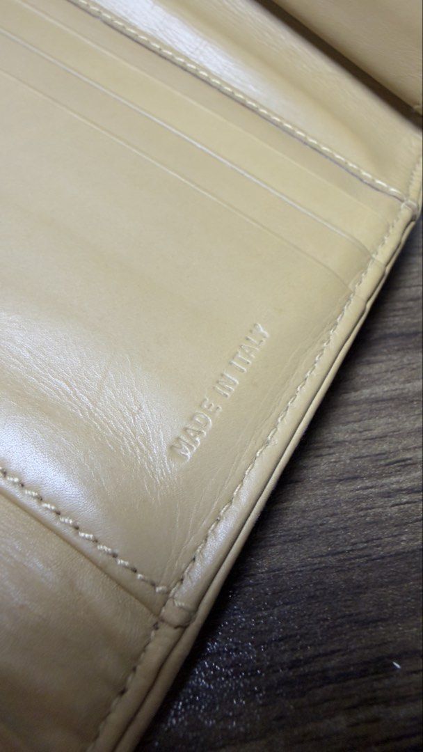 Prada Milano Canvas Bi-fold Wallet Beige (Category: Luxury Bags & Wallets) located in Baguio. Submitted by fndrskprskid (Listing ID 1454349116, Image 3). Description: - Authentic Prada wallet - Beige canvas with leather logo patch - Made in Italy - Multiple card slots for ample storage - Perfect for everyday use - Needs clean only - Vintage.
