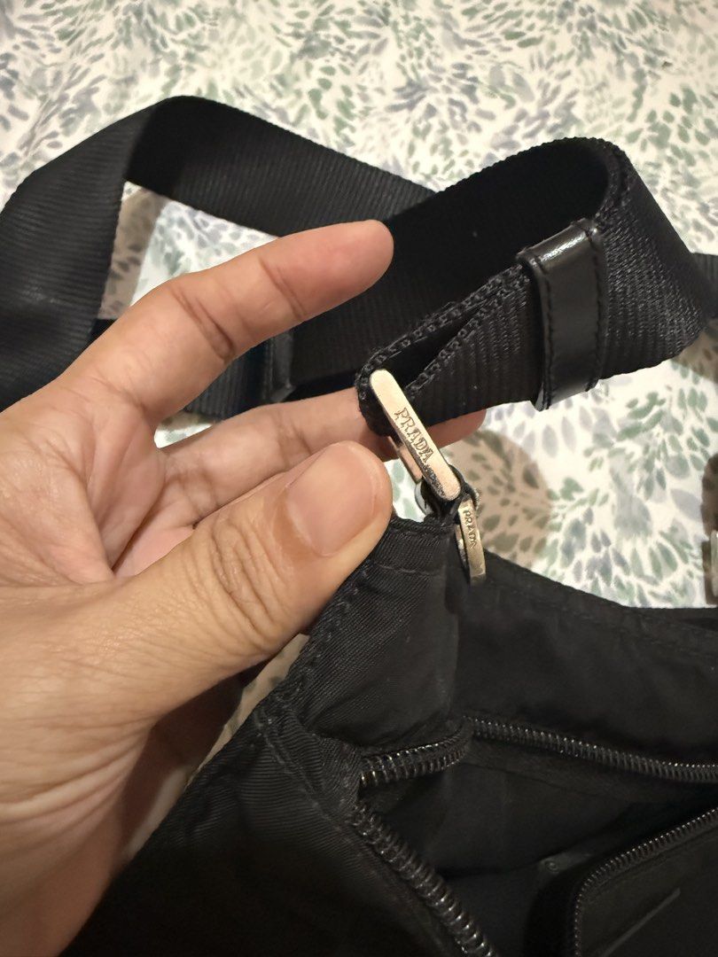 Prada Nylon Crossbody Bag Black (Category: Luxury Bags & Wallets) located in Manila. Submitted by gentlewoman_2026 (Listing ID 1454199532, Image 3). Description: - Classic Prada crossbody bag - Durable black nylon material - Iconic Prada triangle logo - Adjustable shoulder strap for comfort - Secure zipper closure - Ideal for everyday use - Simple and functional design.
