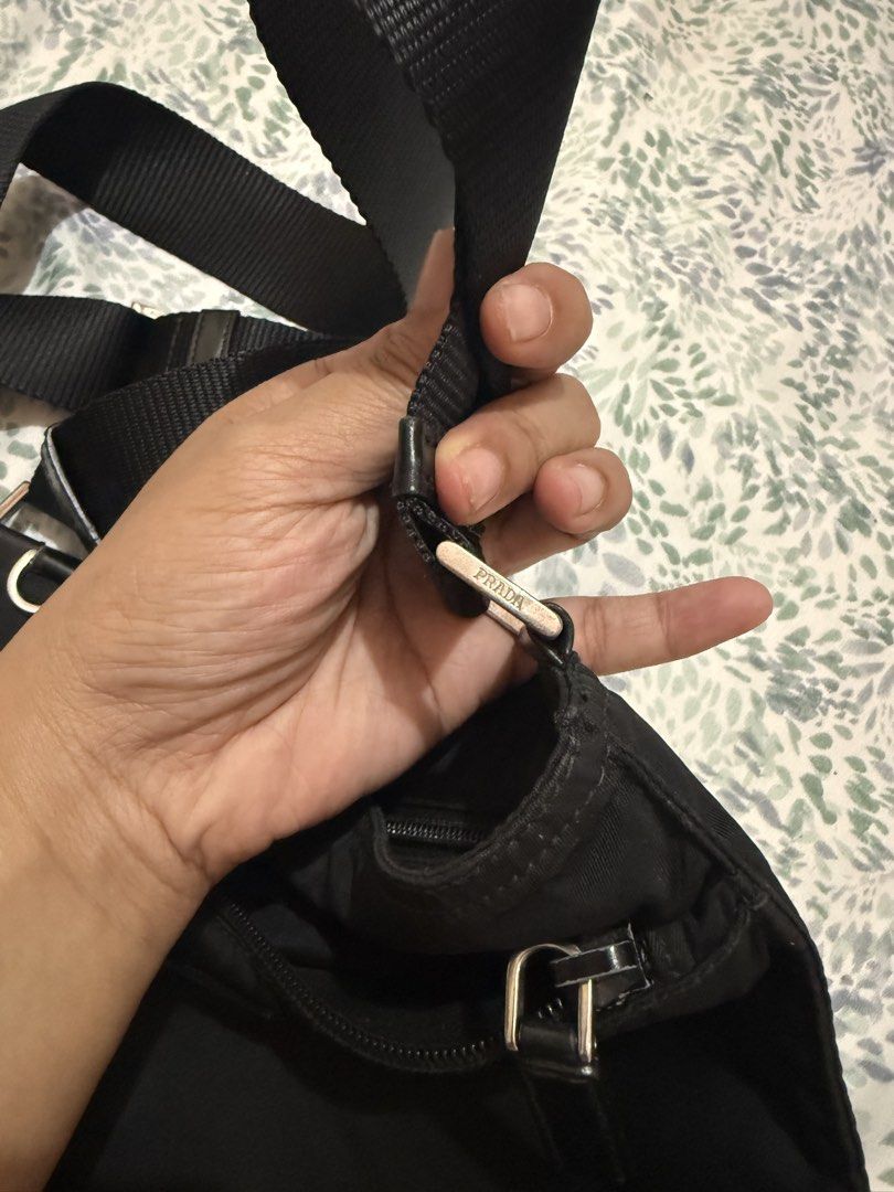 Prada Nylon Crossbody Bag Black (Category: Luxury Bags & Wallets) located in Manila. Submitted by gentlewoman_2026 (Listing ID 1454199532, Image 2). Description: - Classic Prada crossbody bag - Durable black nylon material - Iconic Prada triangle logo - Adjustable shoulder strap for comfort - Secure zipper closure - Ideal for everyday use - Simple and functional design.