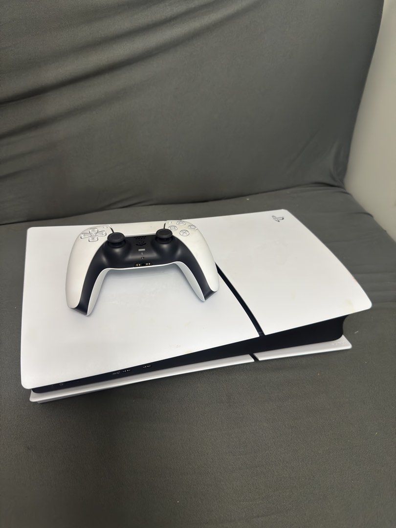 PS5 Slim 1TB with 1 controller (Category: PlayStation) located in Pasig City. Submitted by robbiseraphin (Listing ID 1454275672, Image 1). Description: 🎮 Selling: PS5 Slim 1TB Disc version with 1 dualsense white controller (no box) ✅ Inclusives: - PS5 Slim 1TB (never been opened or repaired) - latest firmware - 1 dualsense controller - no games - complete wires (HDMI and power chord) - no original box 📅 Purchased 2024 🧾 no receipt (misplaced) 
