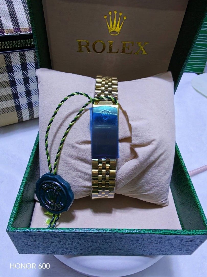 Rolex Gold Watch with Diamonds (Category: Luxury Watches) located in Caloocan City. Submitted by myriosh (Listing ID 1454238822, Image 2). Description: - Genuine R*lex watch - Features sparkling diamond markers on the dial - Comes with original Rol*x box - Brand new with tag still attached - Classic and elegant Jubilee bracelet - Ready for its next proud owner.