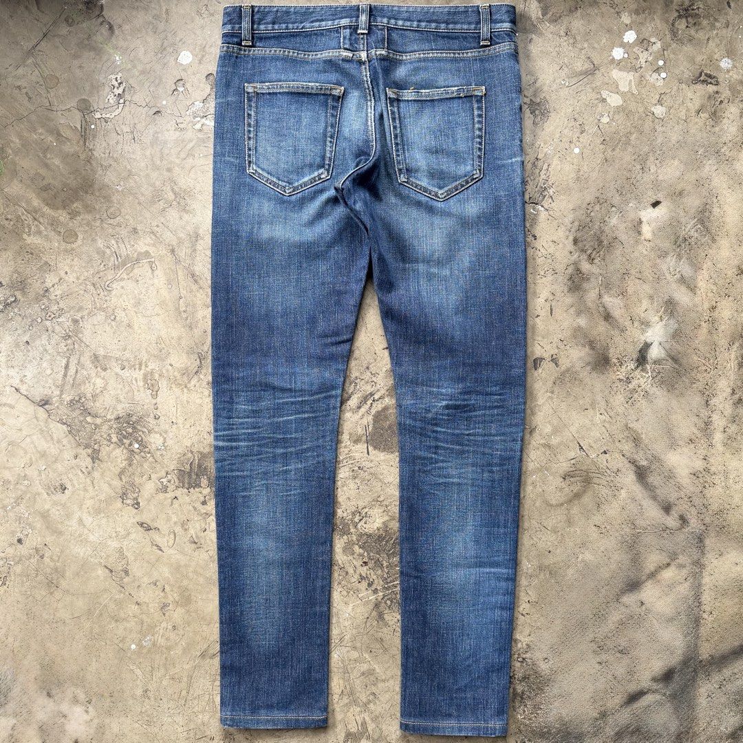 Saint Laurent - Hedi Slimane - 2014 D02 Clawmark Jeans (Category: Jeans) located in Cavite. Submitted by 4118.ph (Listing ID 1454305580, Image 2). Description: Size 30 on tag fits 30-31 9/10 condition Altered length Waist 15.7” Length 39” Inseam 30” Leg opening 5.7”.