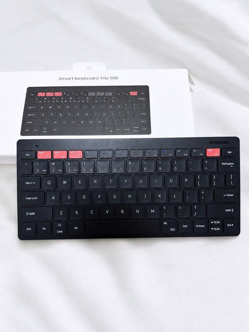 Samsung Smart Keyboard Trio 500 (Category: Computer Keyboard) located in Quezon City. Submitted by silentmood (Listing ID 1454238114, Image 1). Description: - Samsung Smart Keyboard Trio 500 - Wireless connectivity - Dedicated app buttons for quick access - Slim and portable design - Ideal for tablets and smartphones - Includes Samsung DeX button - Color: Black.