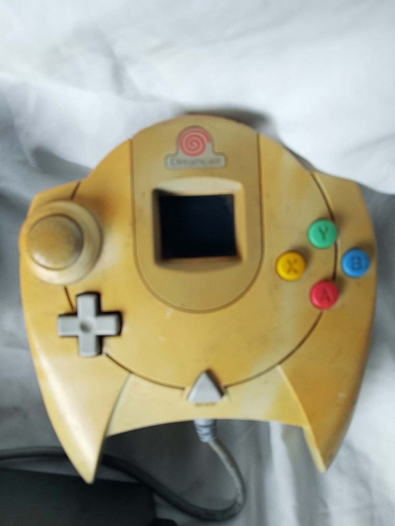 Sega Dreamcast Controller, N64 Game, Arcade Stick (Category: Others) located in Quezon City. Submitted by jpnvintageonline (Listing ID 1454324850, Image 2). Description: - Sega Dreamcast Controller (Yellowed) - Arcade Stick with Joystick and Multiple Buttons - Nintendo 64 Game: Quake 64 - Bundle Deal for Retro Gamers!.