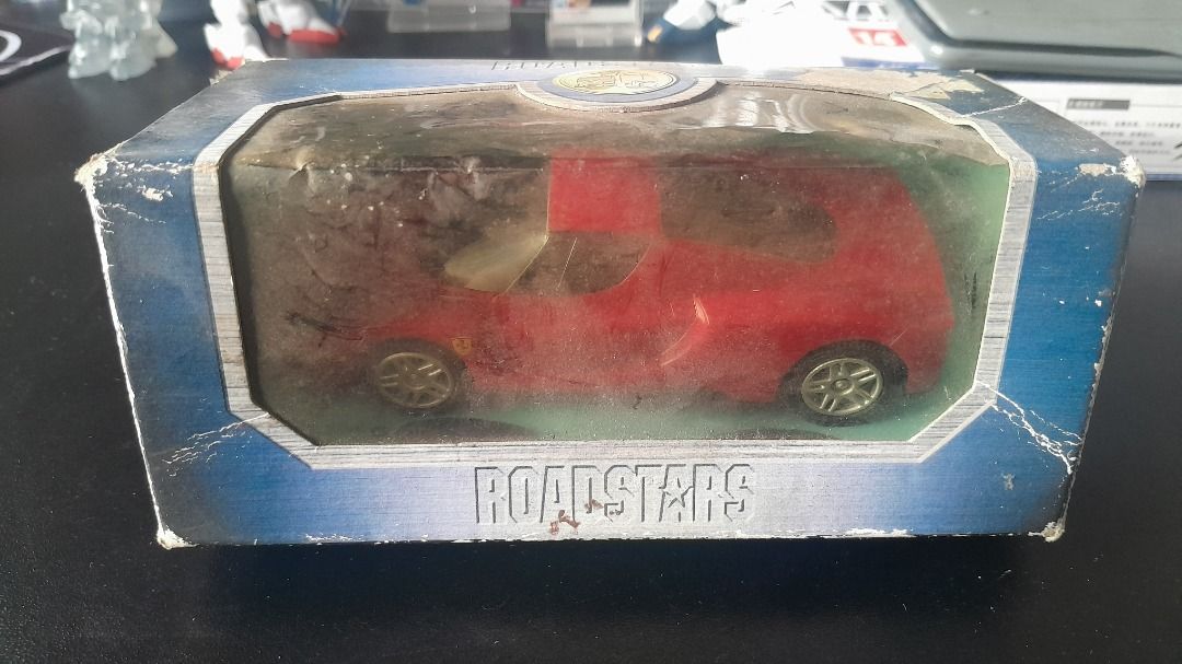 Shell V-Power - Ferrari Enzo diecast model (Category: Vehicle & Diecast Models) located in Cainta. Submitted by lesleyblckvlvt (Listing ID 1454241127, Image 1). Description: An authentic Ferrari Enzo model car from the Shell V-Power Ferrari Collection. Good as a budget display piece or restoration project for diecast collectors and Ferrari enthusiasts. - The car's clear plastic windows have yellowed out over time due to age and sunlight exposure.