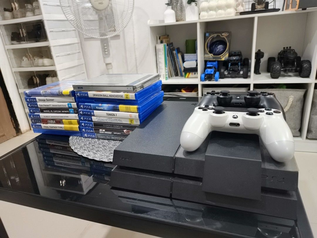 Sony PlayStation 4 Console with 2 Controllers and Games (Category: PlayStation) located in Quezon City. Submitted by darkillumi96099 (Listing ID 1454236435, Image 1). Description: - PS4 Console (not jb) - 2 Controllers (1 Black, 1 White) - Bundle of Popular PS4 Games (including Omega Quintet, Fairy Fencer F, Marvel vs Capcom Infinite, NBA 2K15, Final Fantasy Type-0, Dragon Ball Xenoverse, Knack, Tekken 7, Tales of Zestiria, Shadow of Mordor, Gran