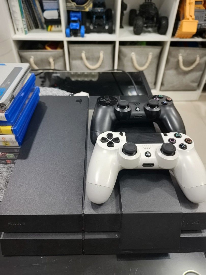 Sony PlayStation 4 Console with 2 Controllers and Games (Category: PlayStation) located in Quezon City. Submitted by darkillumi96099 (Listing ID 1454236435, Image 2). Description: - PS4 Console (not jb) - 2 Controllers (1 Black, 1 White) - Bundle of Popular PS4 Games (including Omega Quintet, Fairy Fencer F, Marvel vs Capcom Infinite, NBA 2K15, Final Fantasy Type-0, Dragon Ball Xenoverse, Knack, Tekken 7, Tales of Zestiria, Shadow of Mordor, Gran