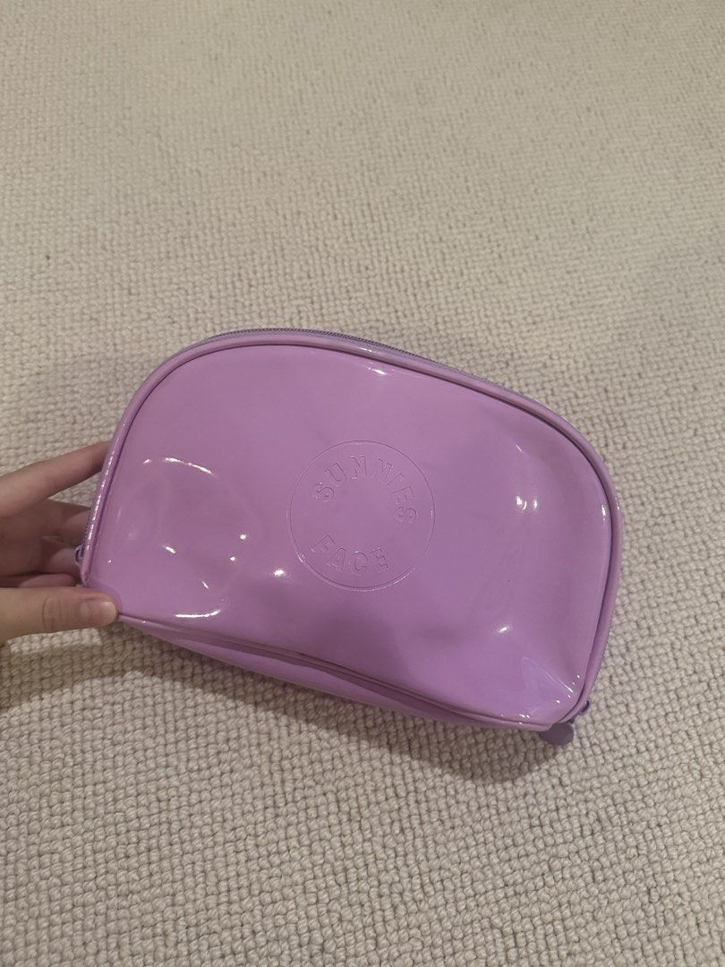 Sunnies Face Purple Pouch (Category: Makeup) located in Muntinlupa City. Submitted by sabnava (Listing ID 1454276351, Image 1). Description: - FREEBIE for purchased make up items over ₱2,300 - Bought in 2021, barely used - There are visible stains in the interior but can be removed when washed - No flaking!.