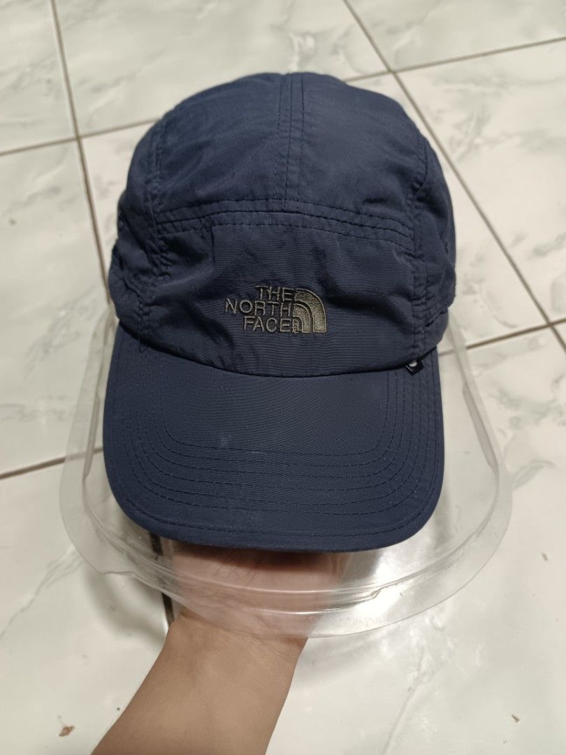 The North Face Navy Blue Cap (Category: Caps & Hats) located in Manila. Submitted by caaths_collection (Listing ID 1454359482, Image 1). Description: - Brand: The North Face - Color: Navy Blue - Material: Polyester - Features: Embroidered logo on front and back, adjustable strap - Ideal for: Outdoor activities and casual wear - Original .