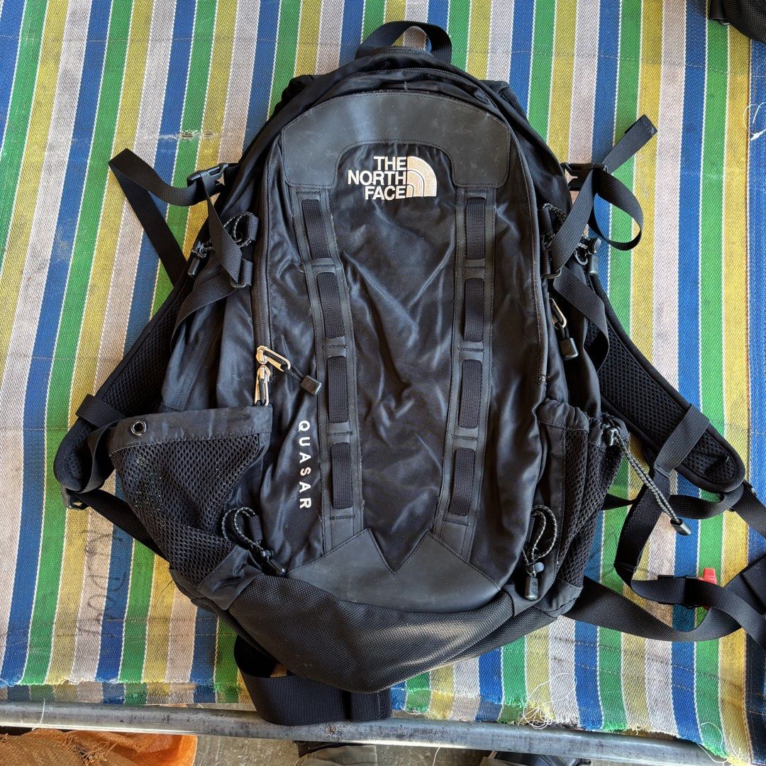 The North Face Quasar Backpack Black (Category: Backpacks) located in Banga. Submitted by akosiloco (Listing ID 1454194475, Image 1). Description: - Black The North Face Quasar backpack - Multiple compartments and pockets for ample storage - Adjustable straps for a comfortable fit - Chest strap with built-in whistle for safety - Ideal for hiking adventures or everyday carry - Please check photos for detailed condition.