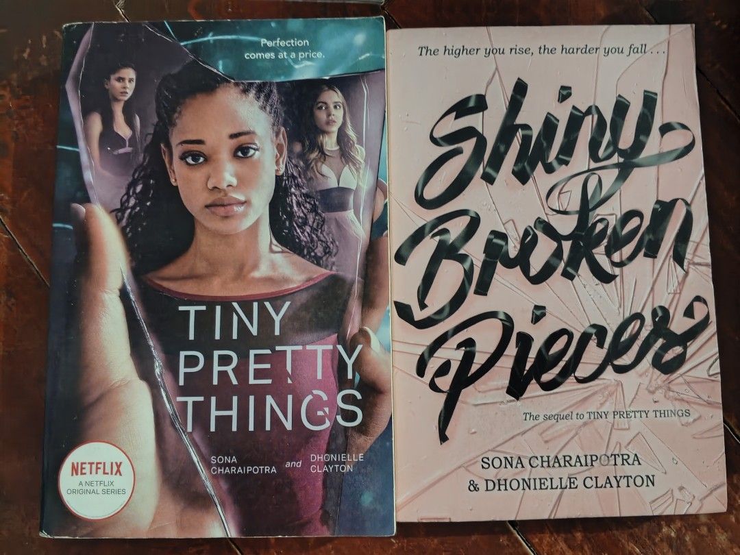 Tiny Pretty Things & Shiny Broken Pieces Books (Category: Storybooks) located in Carmona. Submitted by airab_1128 (Listing ID 1454351871, Image 1). Description: - Set includes the first two books of the Tiny Pretty Things series: 'Tiny Pretty Things' and 'Shiny Broken Pieces'. - Authors: Sona Charaitpotra and Dhonielle Clayton. - 'Tiny Pretty Things' is the basis for the Netflix original series. - 'Shiny Broken Pieces' is the sequel to 'Tiny Pret