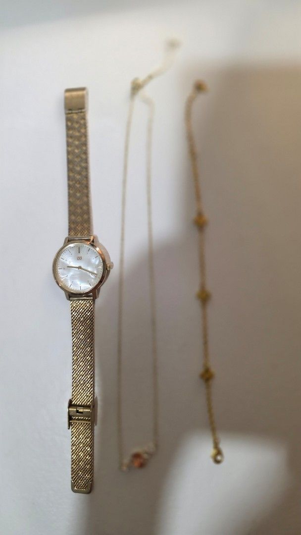 Tommy Gold Tone Watch preloved (Category: Necklaces) located in Iloilo. Submitted by stellas21 (Listing ID 1454194748, Image 1). Description: - Gold tone watch with a stylish mesh band, mother of pearl dial - mikana necklace - cute bracelet bought it for 12,000 issue: change battery RFS: Not using it anymore upgraded to new watch.