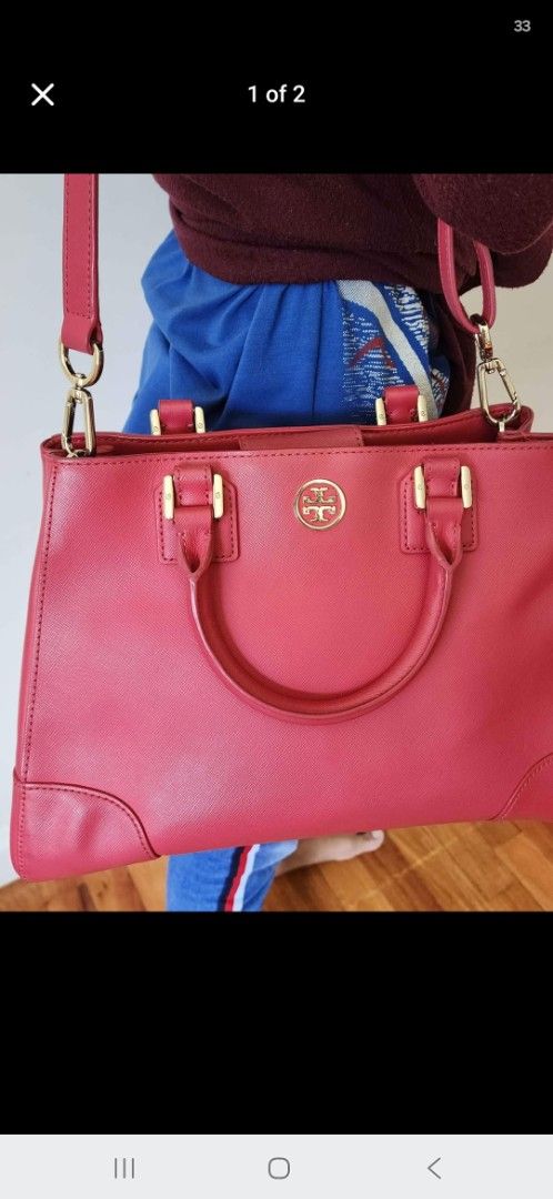 Tory Burch Red Leather Tote Bag with Shoulder Strap (Category: Luxury Bags & Wallets) located in Pasig City. Submitted by ThisandThatAvenue (Listing ID 1454284390, Image 1). Description: - Genuine red leather Tory Burch tote bag - Comfortable top handles - Includes a detachable shoulder strap for versatile carrying - Elegant gold hardware accents - Spacious interior, ideal for essentials - Perfect for everyday errands or travel adventures - Feel 