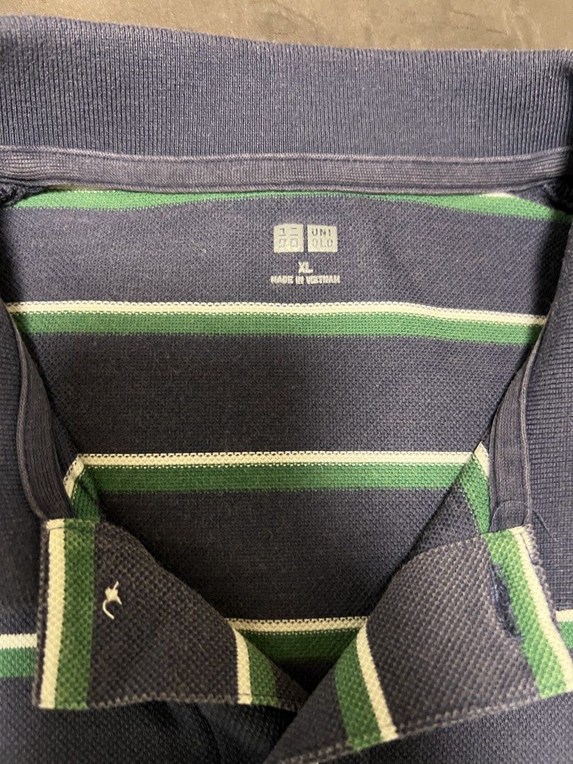 Uniqlo polo shirt (Category: Tshirts & Polo Shirts ) located in Mandaluyong City. Submitted by minimalmeowguy (Listing ID 1454198426, Image 2). Description: Uniqlo polo shirt - cotton fabric - 9.5/10 condition. Used but not abused - dimes are in the photos - not my style anymore.